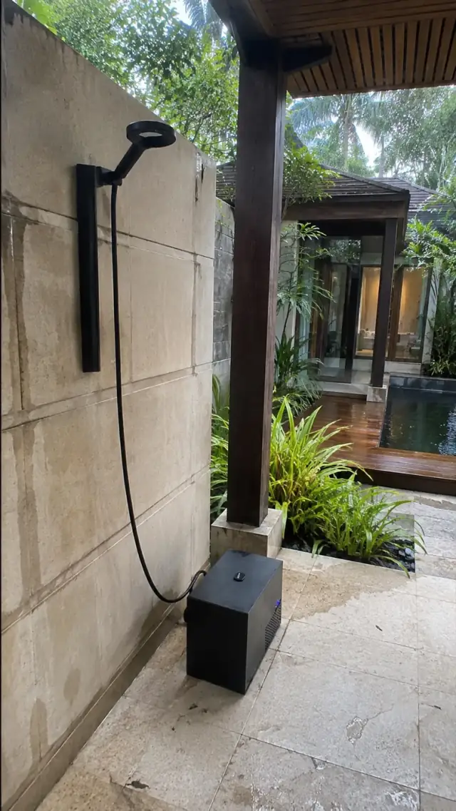 Olsek Ice Shower installed beside a home bath or shower